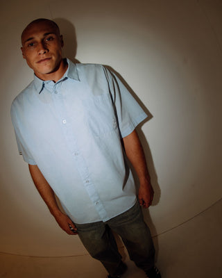 Man wearing Hoodus Check Short Sleeve Shirt in Smoke Blue