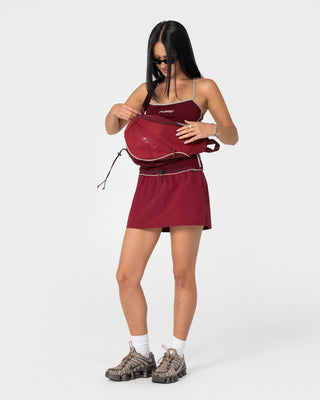 Womens Free Run Nylon Sling Backpack in Burgundy