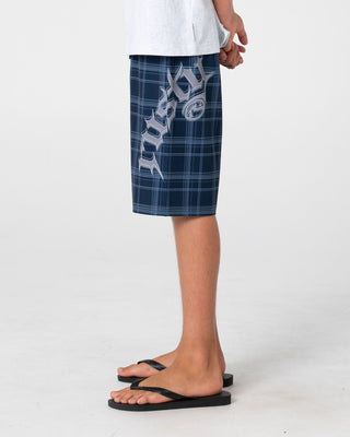 Boy wearing Scream Fixed Waist Boardshort Boys in Navy Blue Plaid