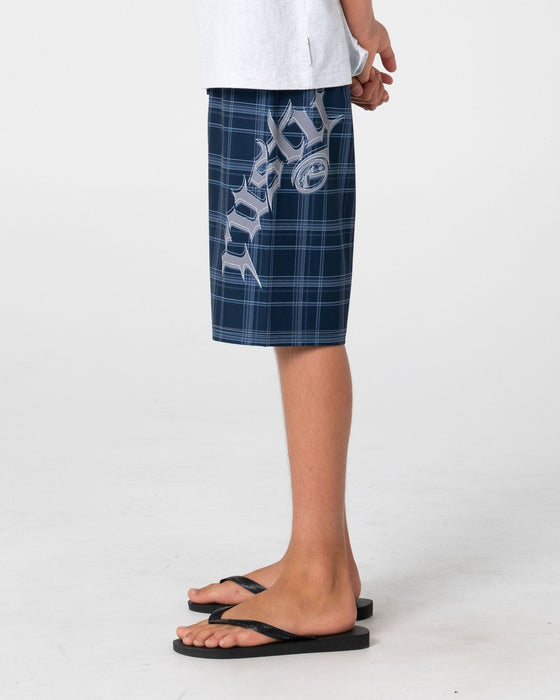 boy-wearing-scream-fixed-waist-boardshort-boys-in-navy-blue-plaid