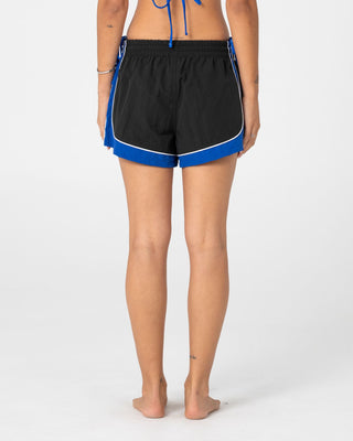 Woman wearing Elastic Panel Crank Boardshort in Coal