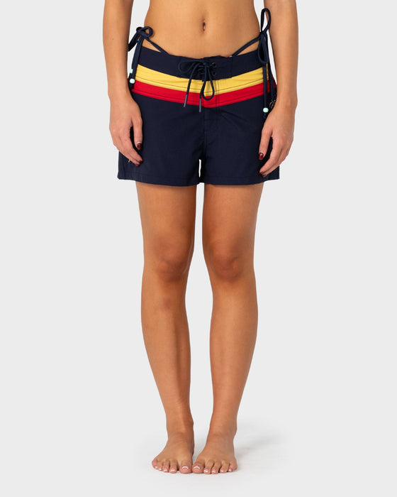 woman-wearing-onya-sonya-archival-boardshort-in-navy-blue