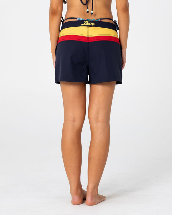 woman-wearing-onya-sonya-archival-boardshort-in-navy-blue