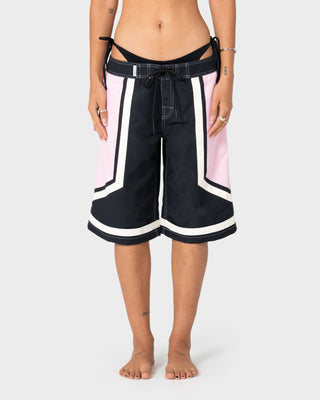 Woman wearing Farrah Long Boardshorts in Black / Pink