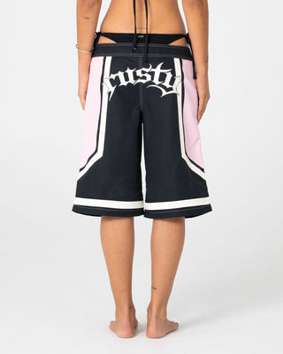 Woman wearing Farrah Long Boardshorts in Black / Pink