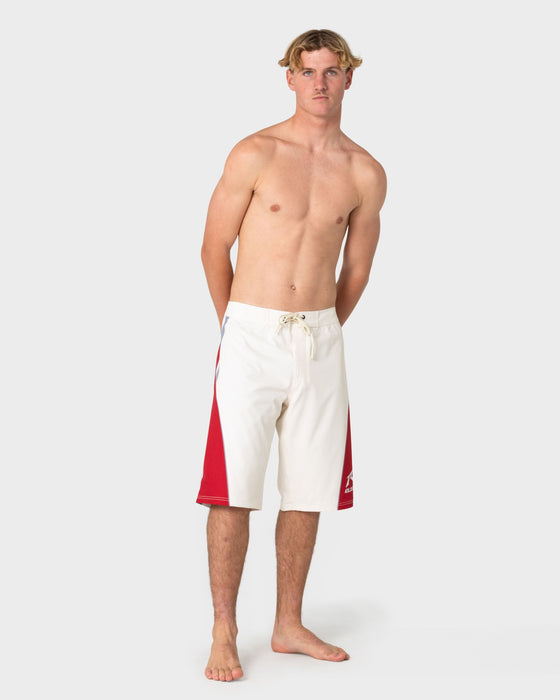 man-wearing-plot-twist-boardshort-in-cream