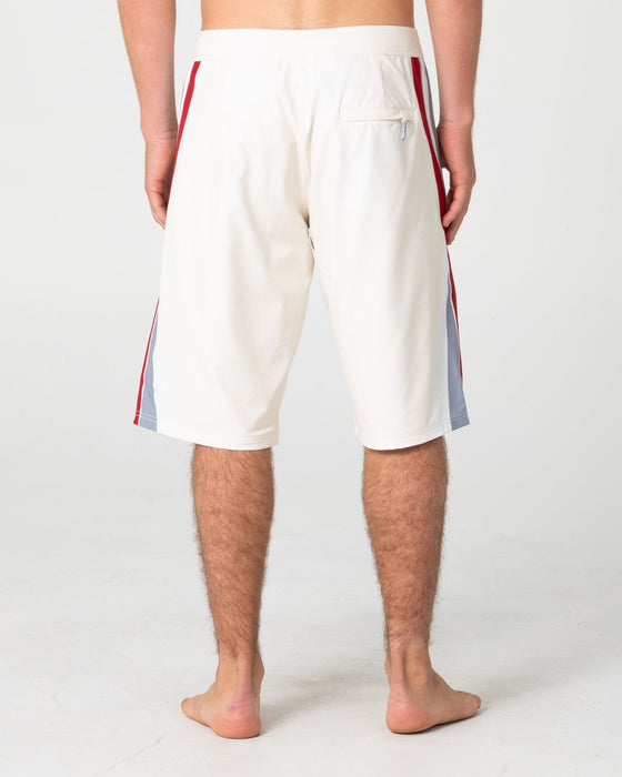 man-wearing-plot-twist-boardshort-in-cream