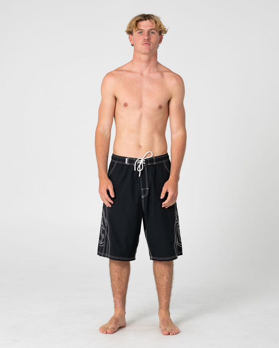 man-wearing-tombstones-hybrid-waist-boardshort-in-black