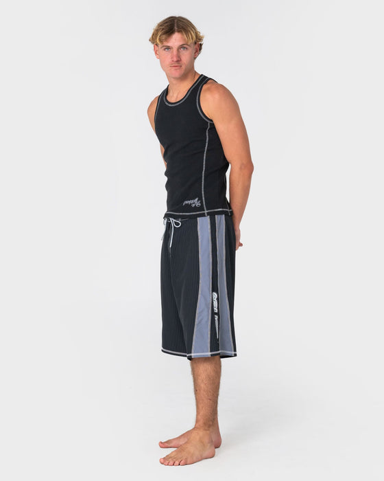 man-wearing-cybernate-fixed-waist-boardshort-in-black-1