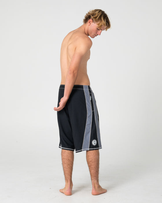 man-wearing-cybernate-fixed-waist-boardshort-in-black-grey