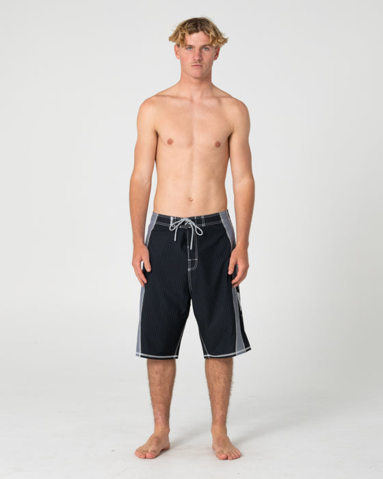 man-wearing-cybernate-fixed-waist-boardshort-in-black-grey