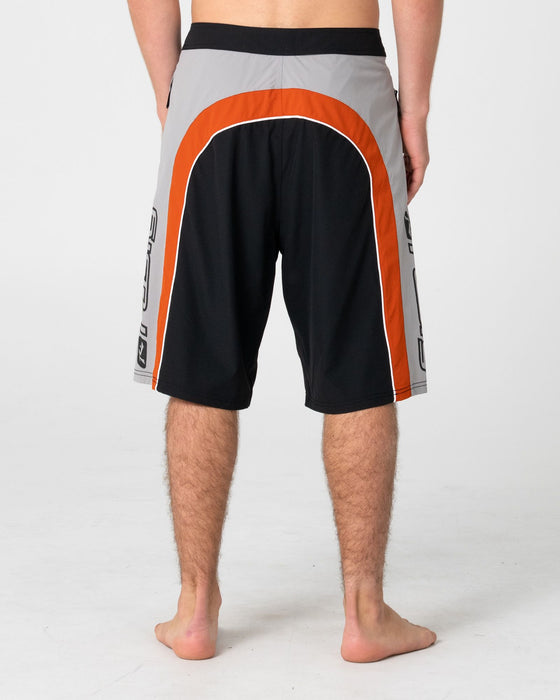 man-wearing-power-wing-fixed-waist-boardshort-in-black