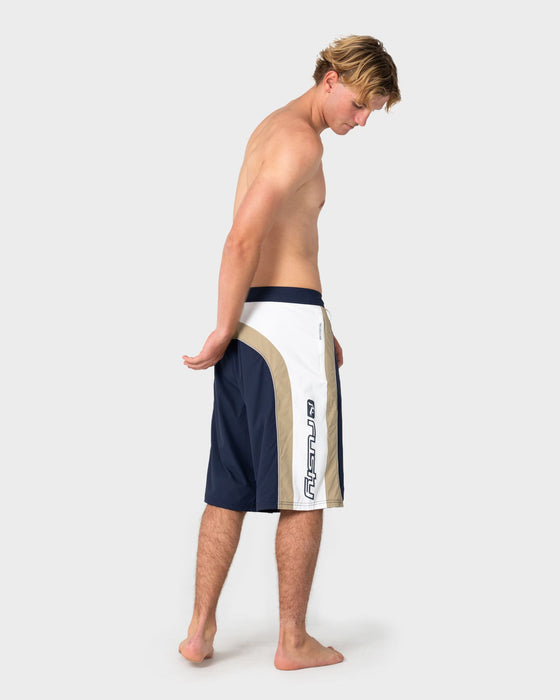 man-wearing-power-wing-fixed-waist-boardshort-in-navy-blue