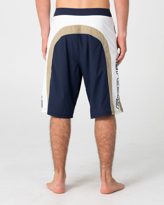 man-wearing-power-wing-fixed-waist-boardshort-in-navy-blue