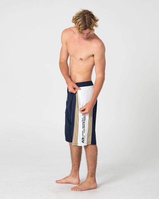 man-wearing-power-wing-fixed-waist-boardshort-in-navy-blue