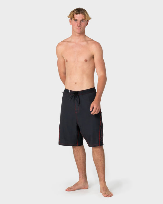 man-wearing-hydro-surge-fixed-waist-boardshort-in-black-1
