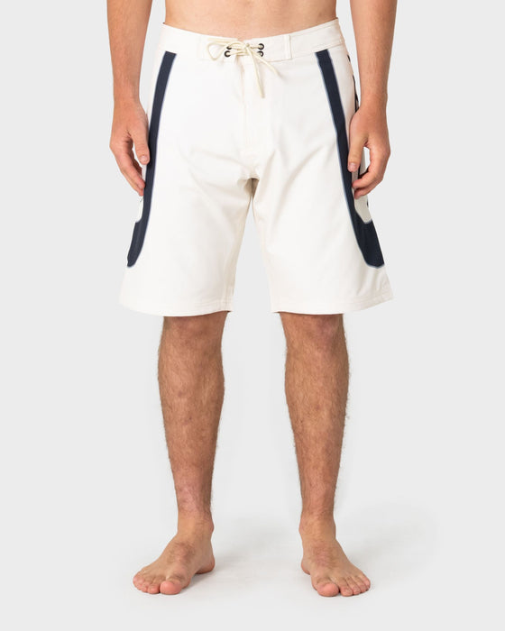 man-wearing-charger-fixed-waist-boardshort-in-cream