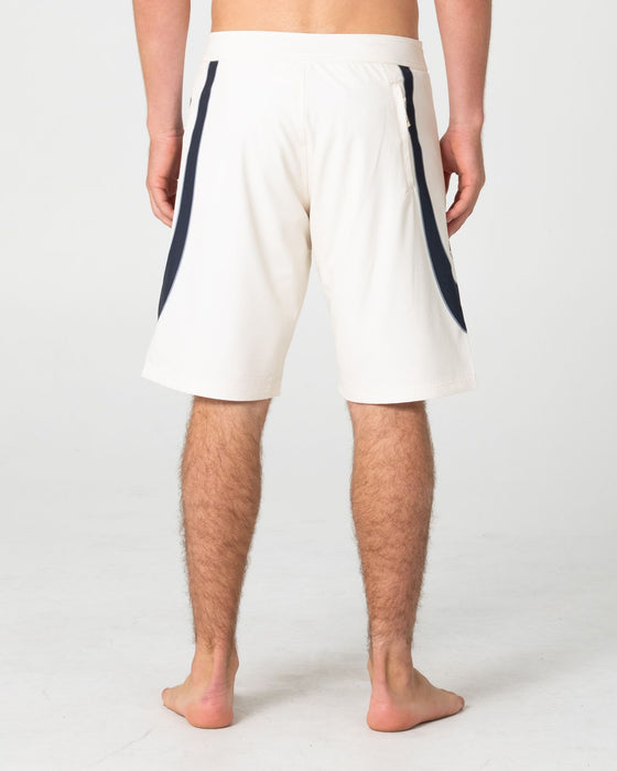man-wearing-charger-fixed-waist-boardshort-in-cream