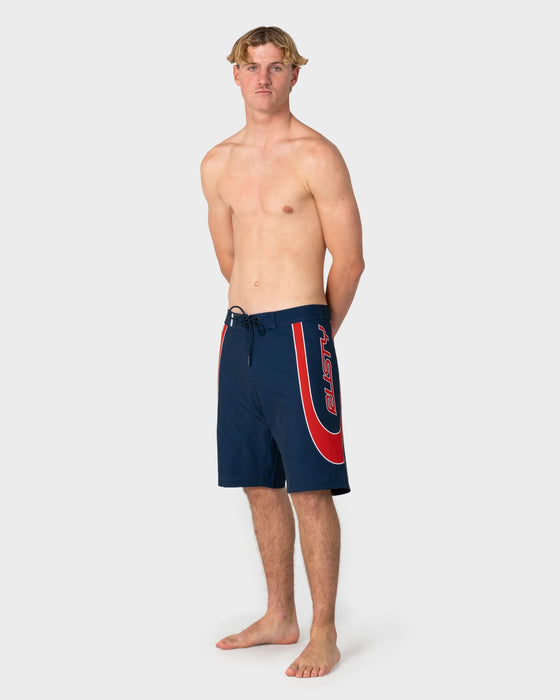 man-wearing-charger-fixed-waist-boardshort-in-navy-blue-1