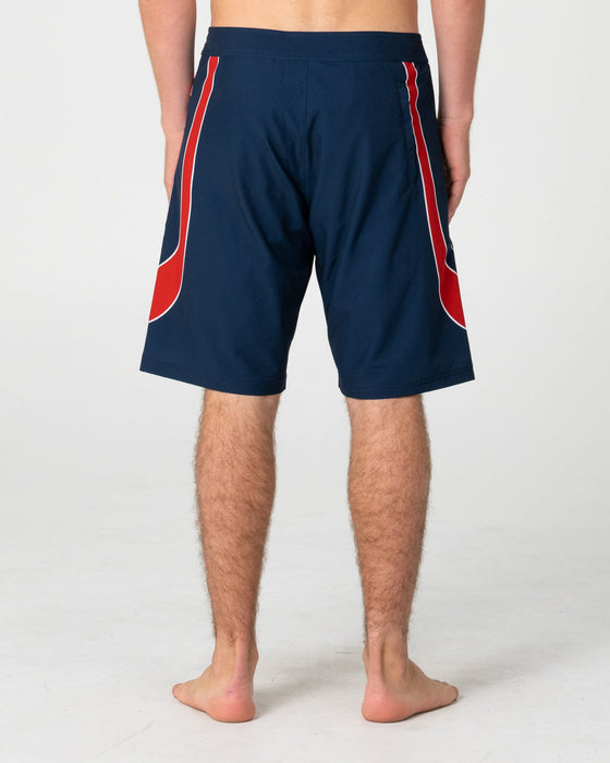 man-wearing-charger-fixed-waist-boardshort-in-navy-blue-1