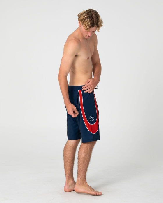 man-wearing-charger-fixed-waist-boardshort-in-navy-blue-1