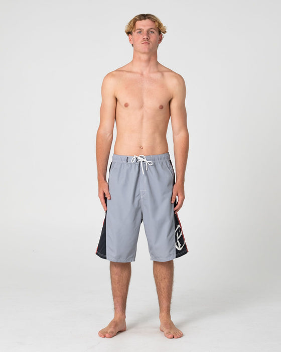 man-wearing-carnage-hybrid-waist-boardshort-in-stone-grey
