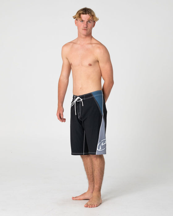 man-wearing-sandglass-fixed-waist-boardshort-in-black