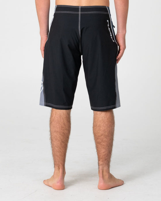 man-wearing-sandglass-fixed-waist-boardshort-in-black