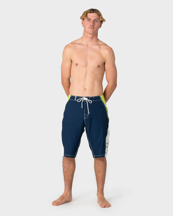 man-wearing-sandglass-fixed-waist-boardshort-in-navy-blue-1