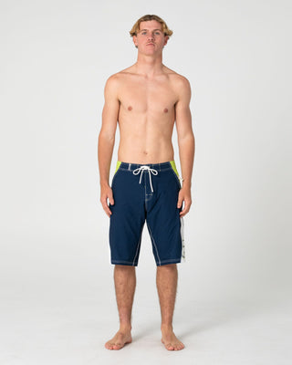 Man wearing Sandglass Fixed Waist Boardshort in Navy Blue 1