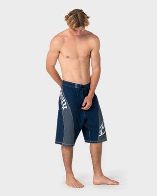 Man wearing Tribalay Fixed Waist Boardshort in Navy Blue