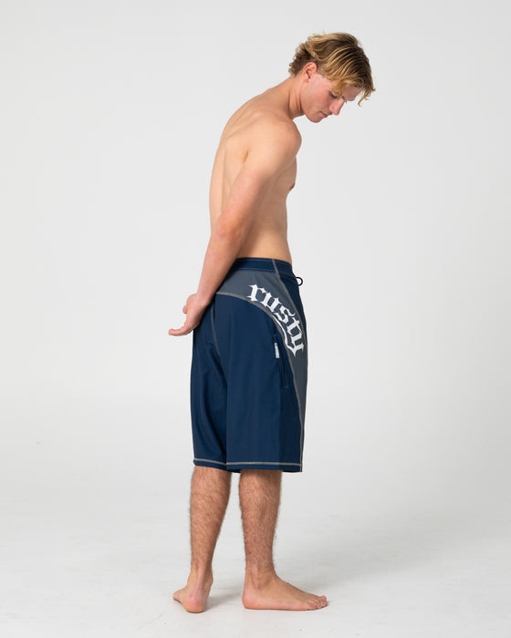 man-wearing-tribalay-fixed-waist-boardshort-in-navy-blue