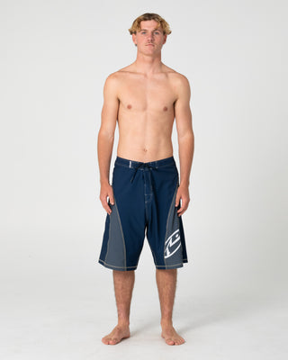 Man wearing Tribalay Fixed Waist Boardshort in Navy Blue