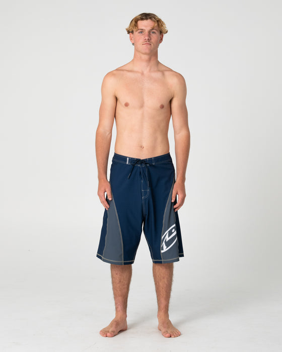 man-wearing-tribalay-fixed-waist-boardshort-in-navy-blue