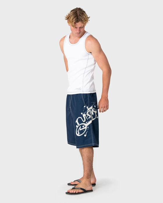 man-wearing-ceathair-hybrid-waist-boardshort-in-navy-blue
