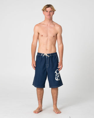 Man wearing Ceathair Hybrid Waist Boardshort in Navy Blue