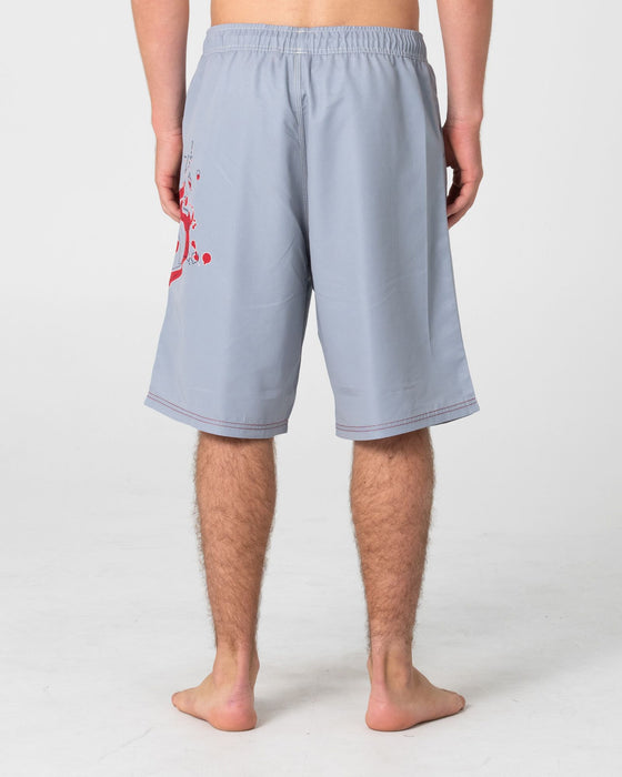 man-wearing-ceathair-hybrid-waist-boardshort-in-stone-grey