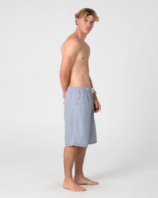 Man wearing Ceathair Hybrid Waist Boardshort in Stone Grey
