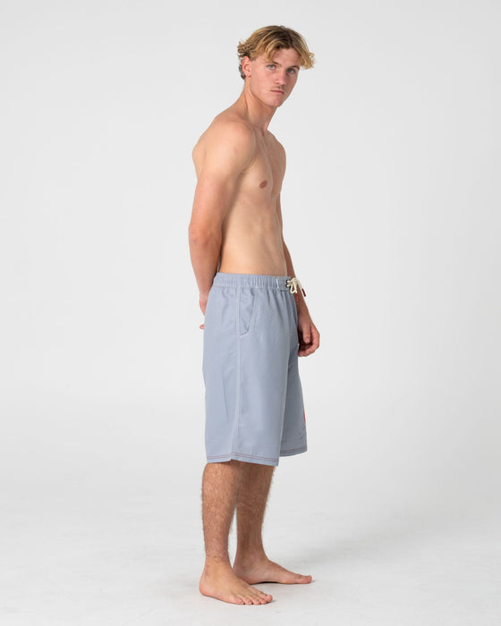 man-wearing-ceathair-hybrid-waist-boardshort-in-stone-grey