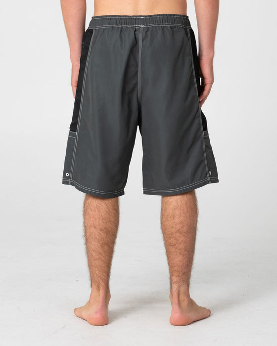 man-wearing-ventilator-hybrid-waist-boardshort-in-army-green