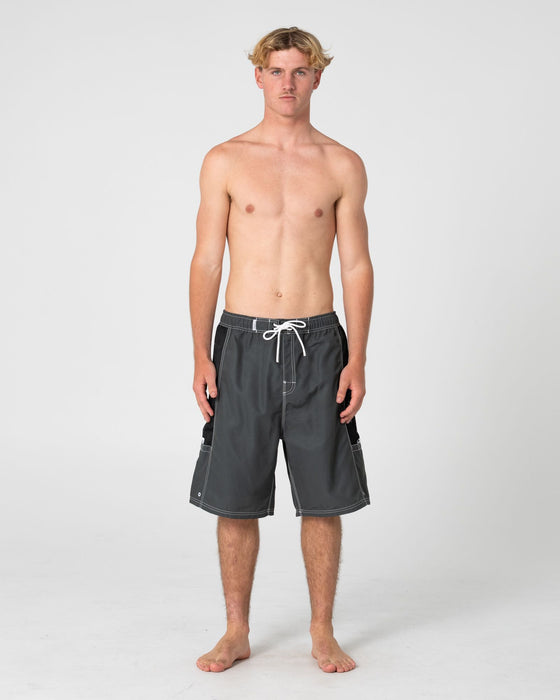 man-wearing-ventilator-hybrid-waist-boardshort-in-army-green