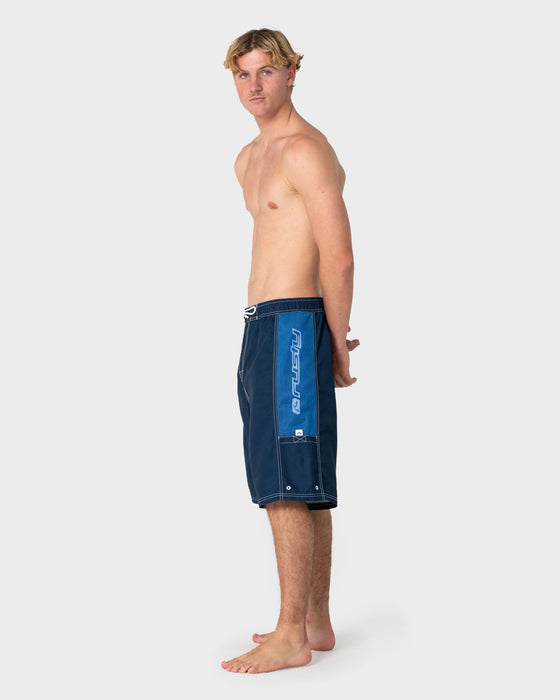 man-wearing-ventilator-hybrid-waist-boardshort-in-navy-blue
