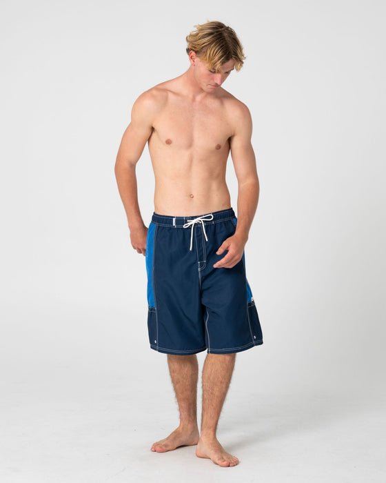 man-wearing-ventilator-hybrid-waist-boardshort-in-navy-blue
