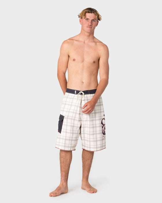 man-wearing-scribbla-fixed-waist-boardshort-in-cream
