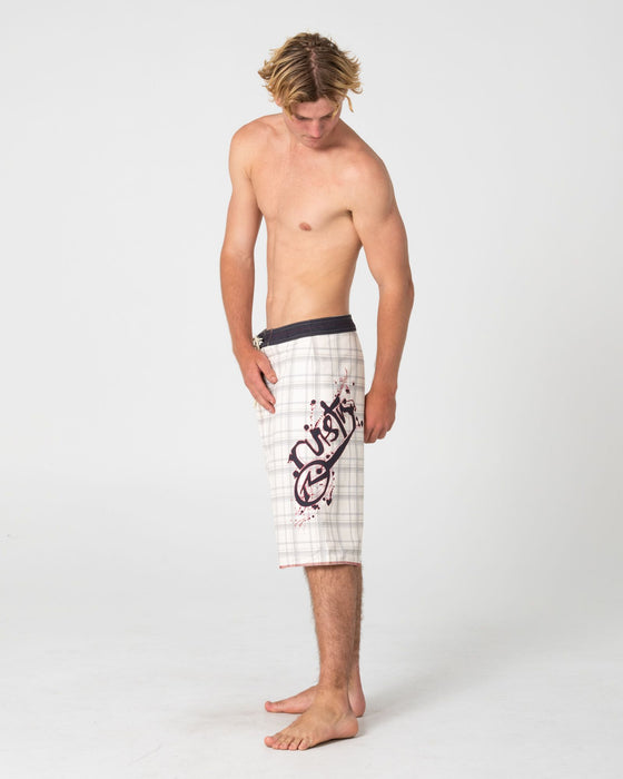 man-wearing-scribbla-fixed-waist-boardshort-in-cream