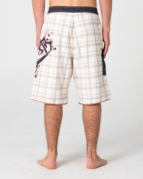 man-wearing-scribbla-fixed-waist-boardshort-in-cream