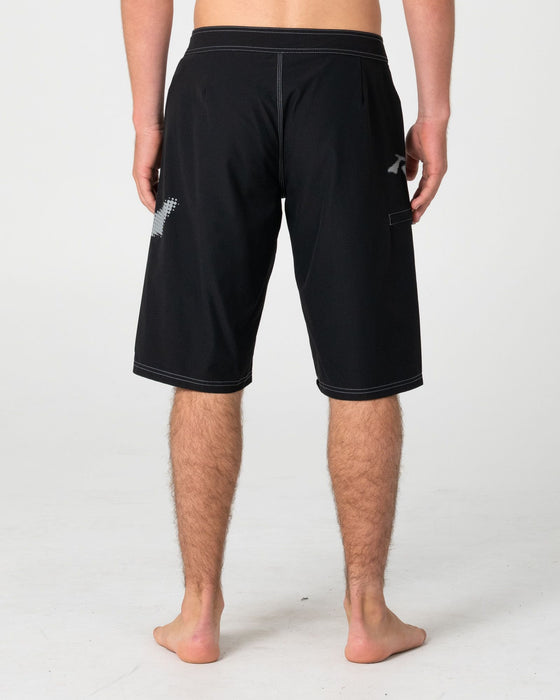 man-wearing-competition-revolution-2-0-boardshort-in-black
