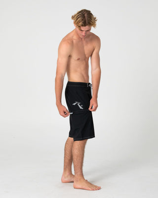 Man wearing Competition Revolution 2.0 Boardshort in Black