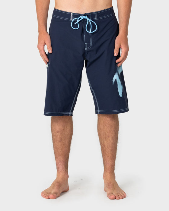 man-wearing-competition-revolution-2-0-boardshort-in-navy-blue