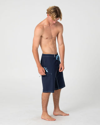 Man wearing Competition Revolution 2.0 Boardshort in Navy Blue